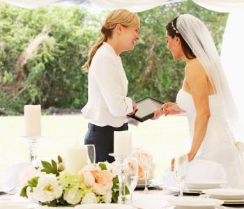 wedding planner talking to bride