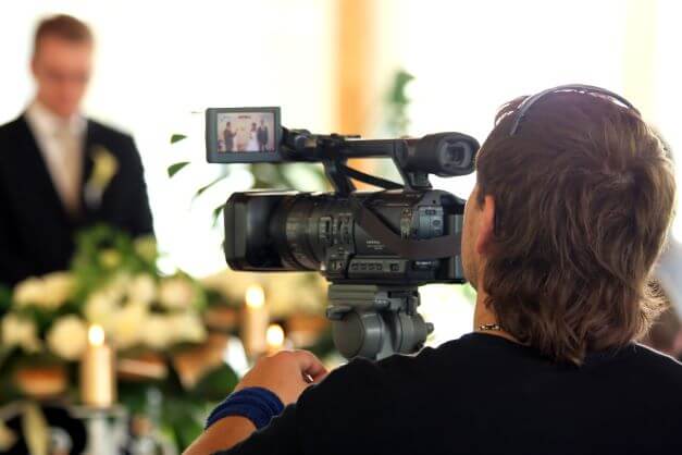 Videographer filming Wedding ceremony