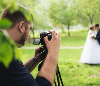 Wedding Videographer filming couple