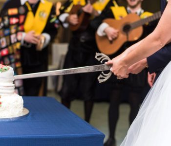 Spanish Bride Cuts cake with a sword